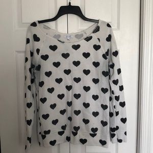 White sweater with black hearts